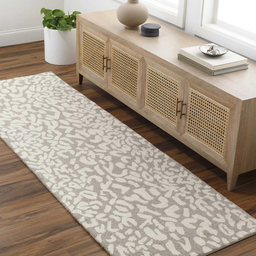 Entryway with wood floors, a console table, and the beige Azuka Leopard Print Area Rug runner. Roomscene-Runner