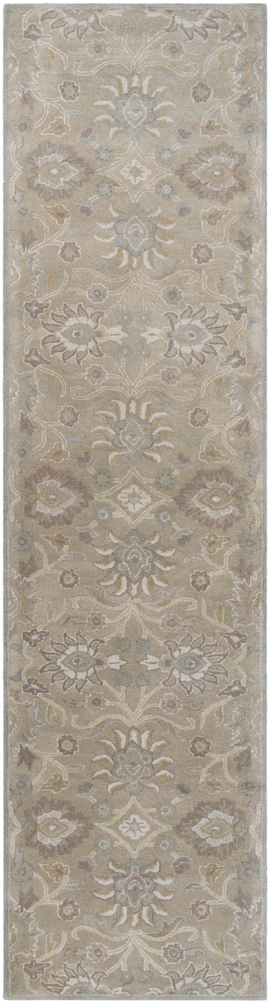 Close-up of the Conesus 1192 rug. Hand-tufted wool rug in ivory, taupe, light brown, and pale blue with a traditional floral pattern. Design-Runner-312