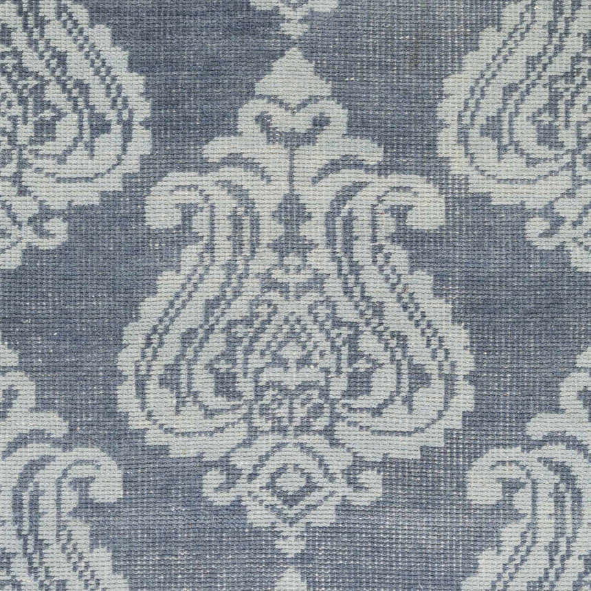 Close-up of the Bargersville Area Carpet. Hand-knotted wool rug in blue and pale blue with a traditional damask pattern. Swatch
