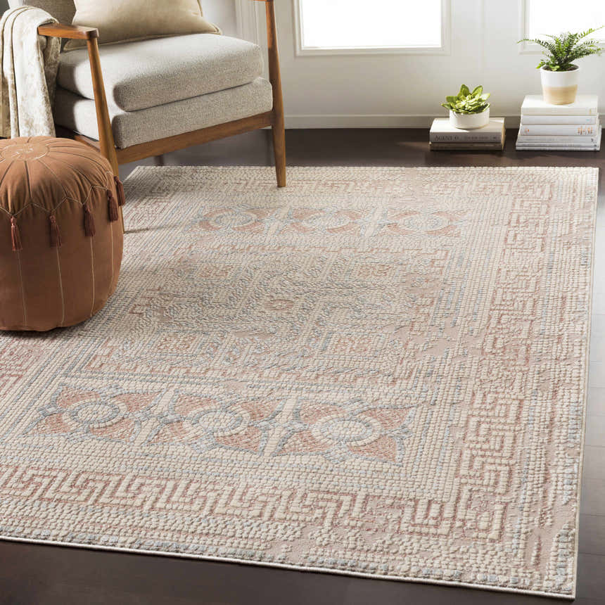 Living room with the Terlingua Blush Greek Mosaic Carpet, tan chair, and brown pouf. Bohemian style. Styleshot