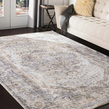 Living room scene with a Beebe Luxe Machine Area Rug, beige sofa, and dark wood floors. Roomscene-Rectangle