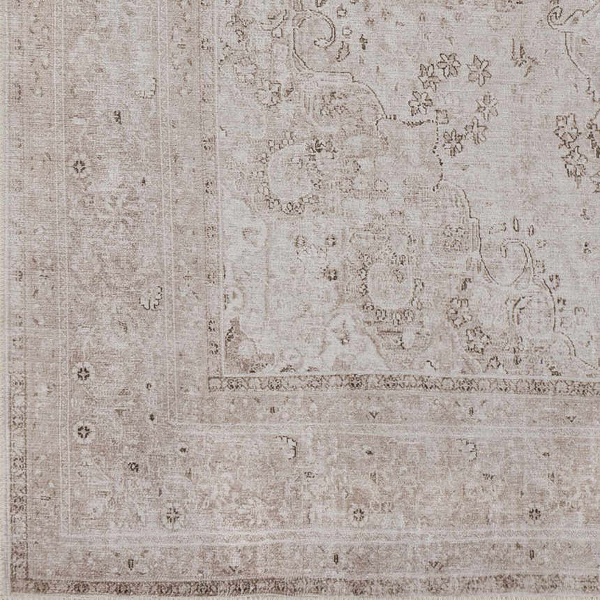 Close-up of the beige Bethany Vintage Flat Pile Washable Rug, showcasing its traditional floral pattern and soft, chenille-polyester texture. Swatch