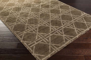 Close-up of the charcoal and medium gray Billingham Area Carpet, hand-knotted with a contemporary geometric pattern. Corner