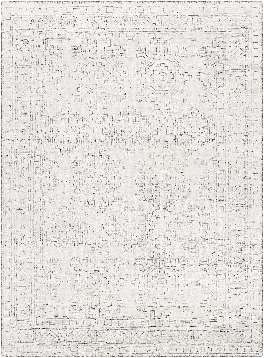 Close-up of the Blackfoot Area Rug. Hand-knotted, farmhouse style rug in black and white with a traditional rectangular pattern. Design-Rectangle-69