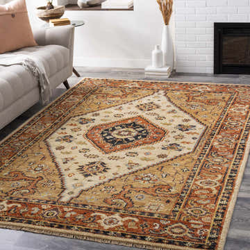Living room scene with a Bolt Small Wool Rug. Traditional design in brick red, tan, and ivory. Sofa and fireplace. Roomscene-Rectangle