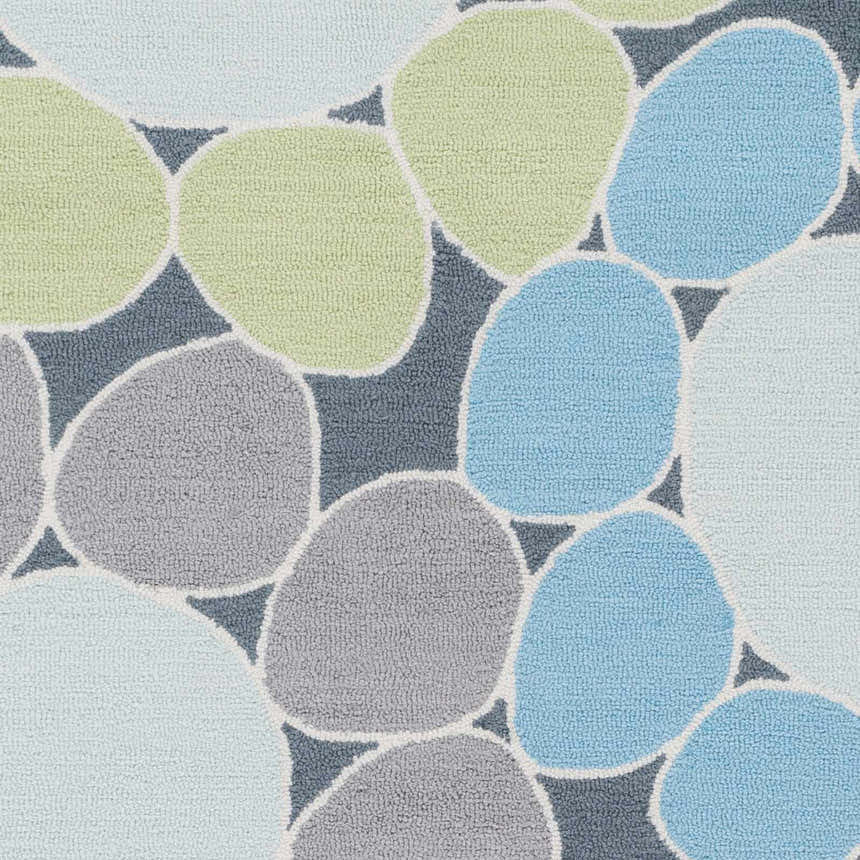 Close-up of Bologna Area Rug with a pebble design in shades of blue, green, and gray. Hand-hooked acrylic texture. Swatch