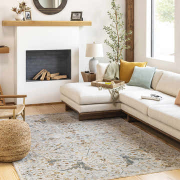 Living room scene with a cream sectional and the light gray Bornova Luxe Oushak Rug. Roomscene-Rectangle