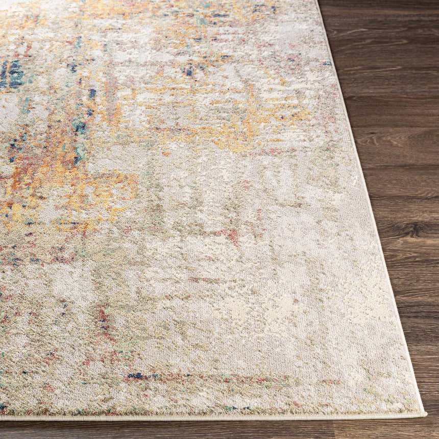 Close-up of the Birchgrove Area Rug showing its cream base and brick red, mustard, and navy abstract design. Front