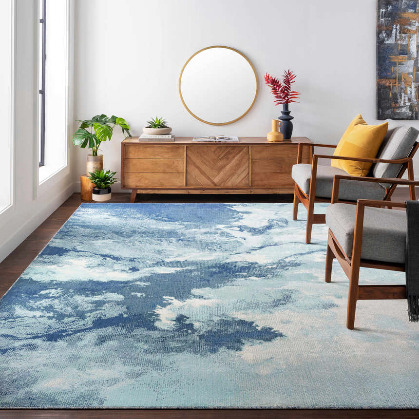 Living room scene with a Bright Sky Indoor/Outdoor Rug in ivory, light slate, navy, and pale blue colors. Roomscene-Rectangle