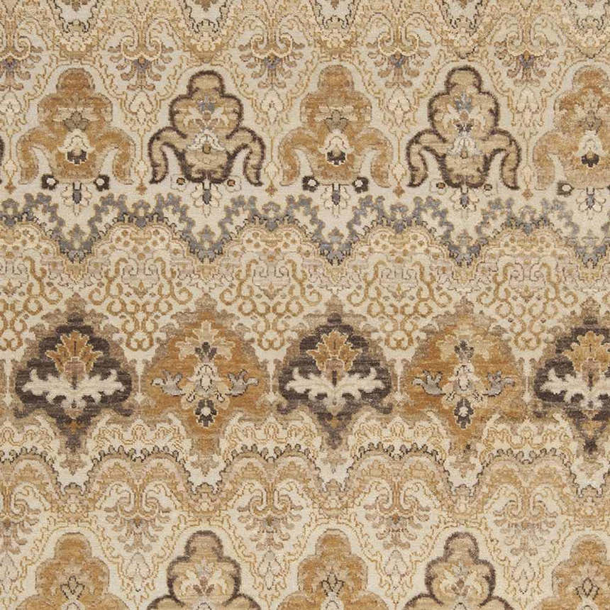 Close-up of the Brimson Area Rug, a hand-knotted wool rug with a traditional pattern in brown, tan, and taupe. Swatch