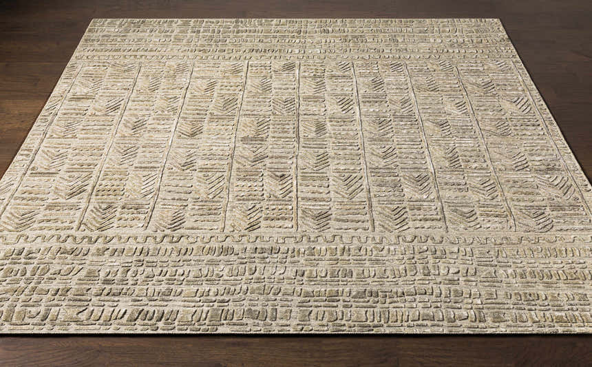 Close-up of the hand-loomed Burlington Clearance Rug in oatmeal and sage, featuring a geometric pattern and textured design. Front