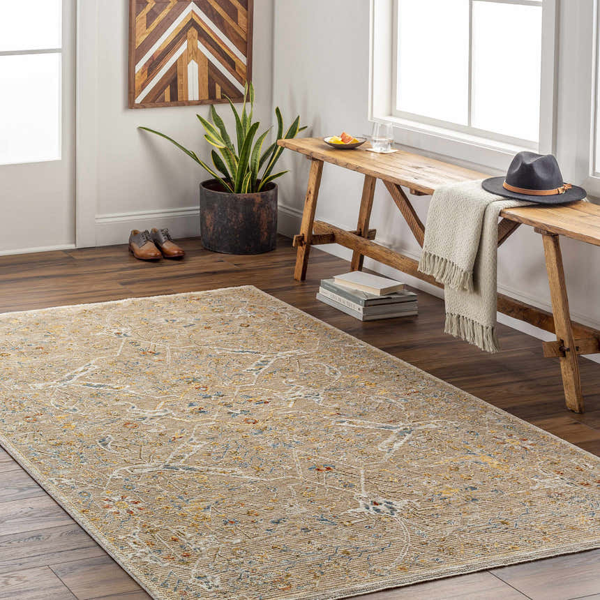 Entryway with a Barneyside Luxe Area Rug in tan, cream, and blue, styled with a wood bench, hat, and shoes. Roomscene-Rectangle