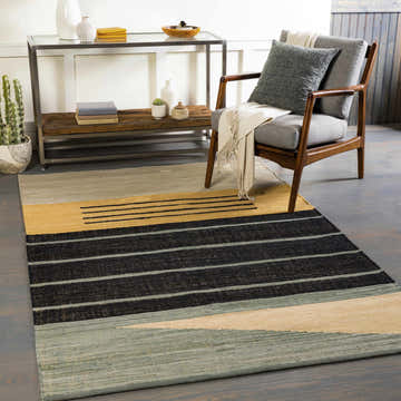 Living room scene with the Bunbury Area Rug, featuring black, teal, wheat, and pale blue stripes under a mid-century modern chair. Roomscene-Rectangle