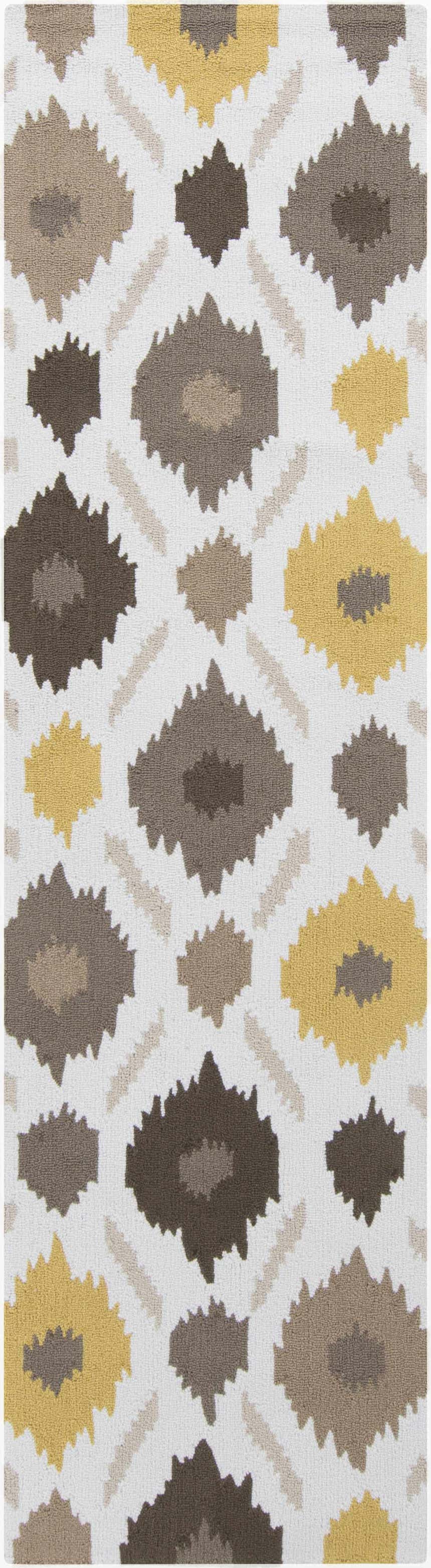 Close-up of the Byhalia Area Rug with a bohemian diamond pattern in beige, brown, ivory, and mustard tones. Design-Runner-38