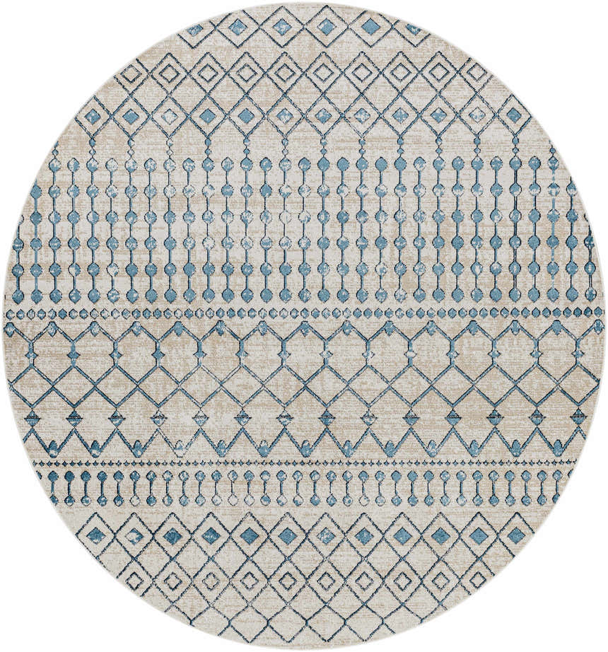 Close-up of round Cabognon Washable Area Rug. Geometric pattern in blue, ink blue, light beige, and light gray. Design-Round-67