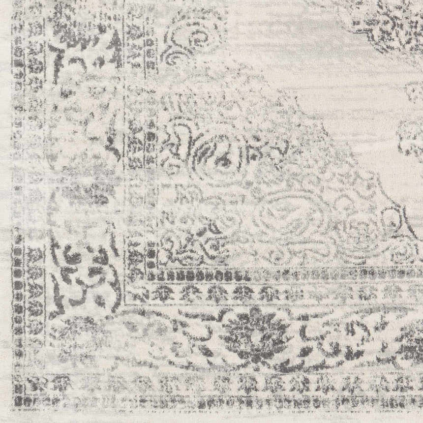 Close-up of the Caloundra Area Rug showing its traditional Oriental design in charcoal, gray, light gray, and white. Swatch