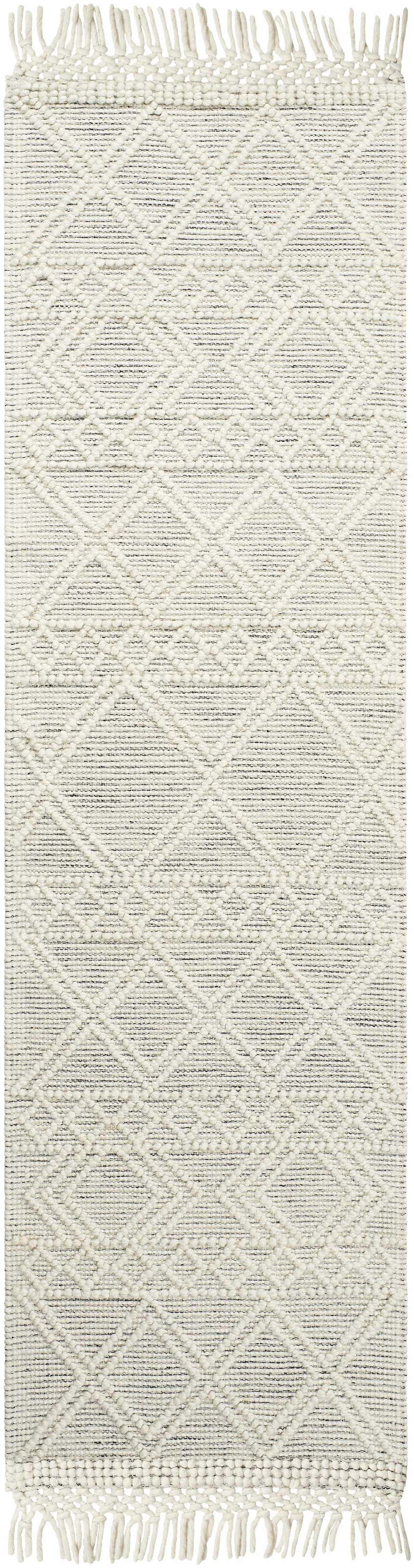 Close-up of Cameo Scandi Wool Rug in bone and gray with a geometric diamond pattern and fringe. Hand woven texture. Design-Runner-2376