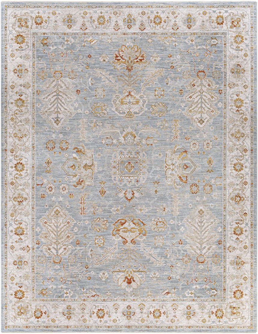 Close-up of the Camrose Thick Luxe Statement Rug. Denim blue rug with traditional floral and geometric patterns in light beige and rust. Design-Rectangle-710103