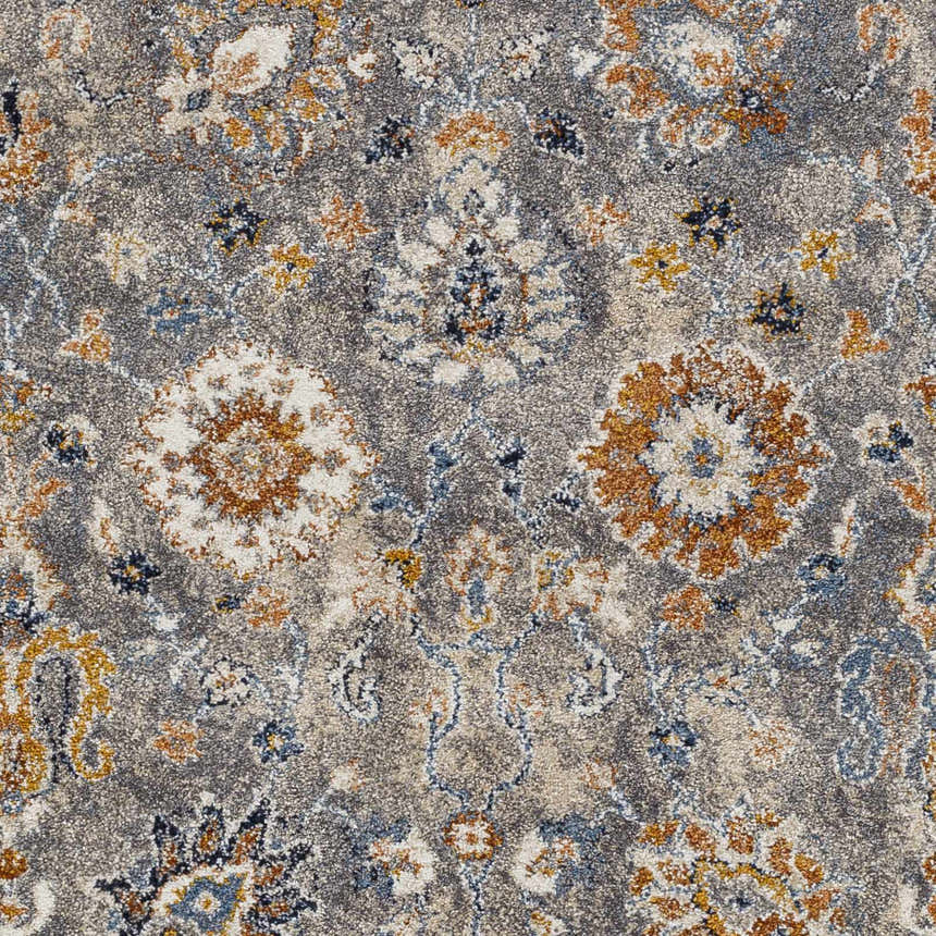 Close-up of the Cogan Gray Thick Rug featuring a traditional floral pattern in gray, blue, cream, and brown tones. Swatch