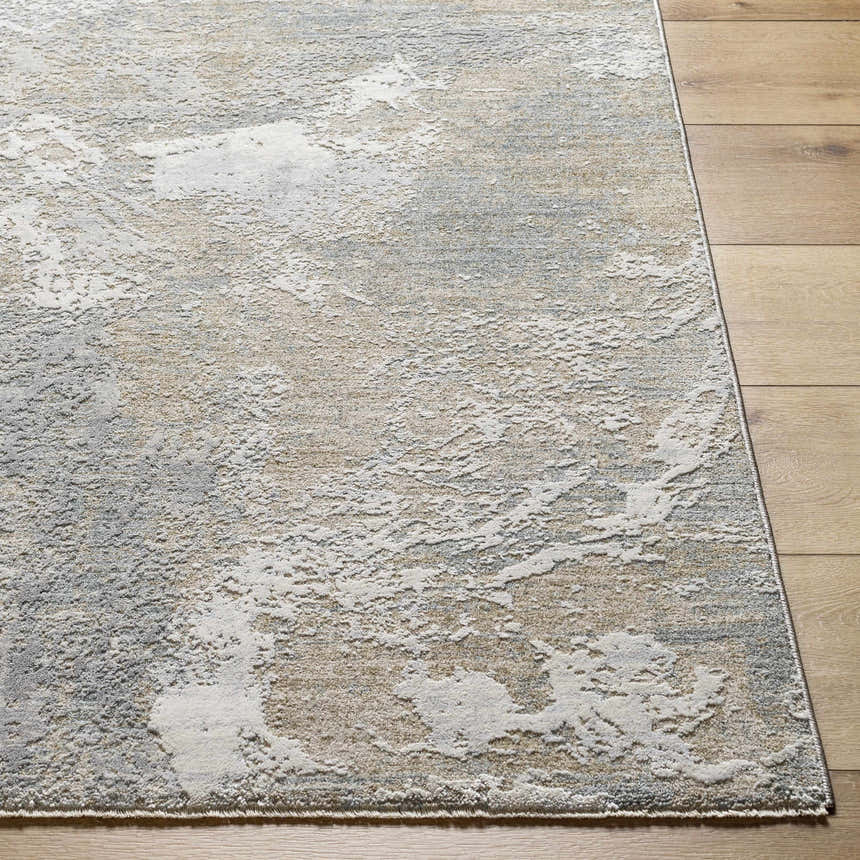 Close-up of the Cady Thick Luxe Area Rug showing its cloud gray, brown, and white abstract pattern and plush texture. Front