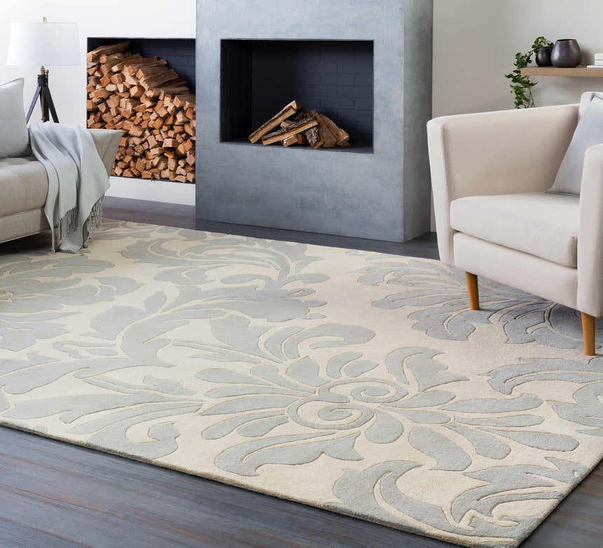 Living room scene with a gray and ivory floral Cementon Area Rug, fireplace, and neutral furniture. Roomscene-Rectangle