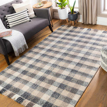 Living room scene with a Chilliwack Gray Plaid Wool Rug, gray sofa, wood floors, and neutral decor. Roomscene-Rectangle