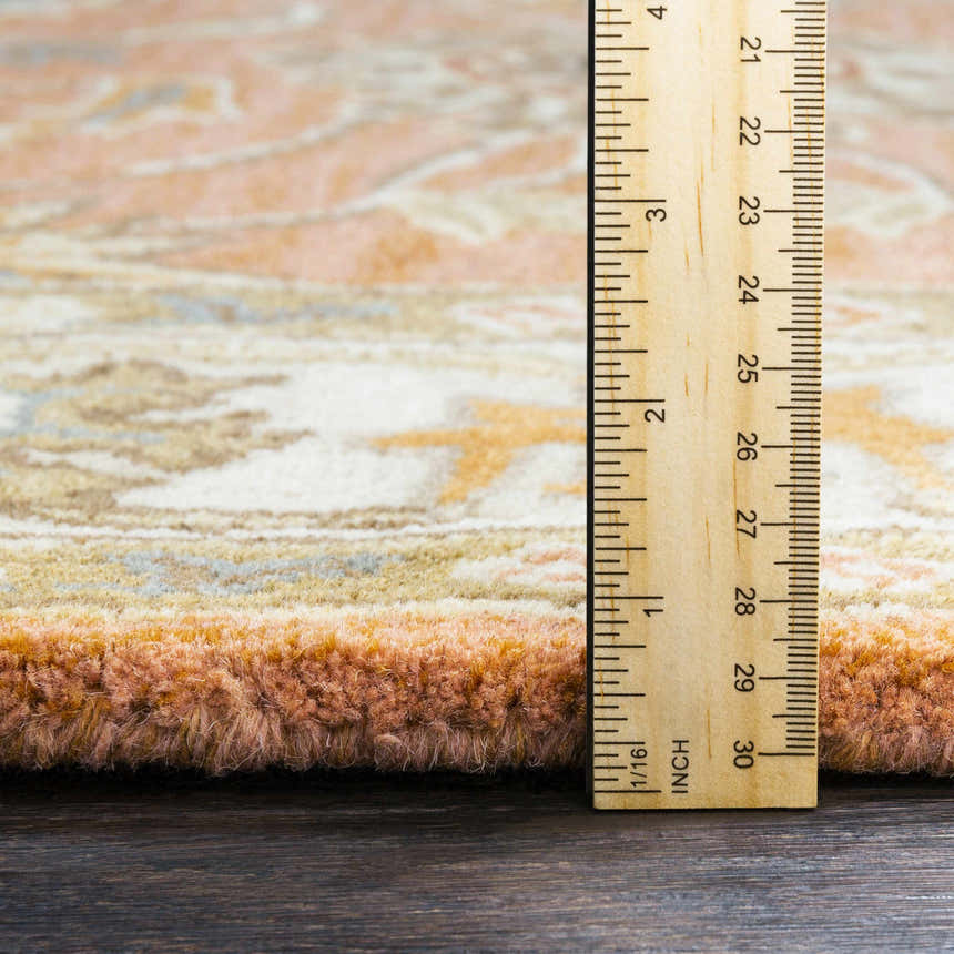 Close-up of the plush texture and pile height of the Caesar Hand Tufted Burnt Orange Wool Carpet, measured with a ruler. Pile