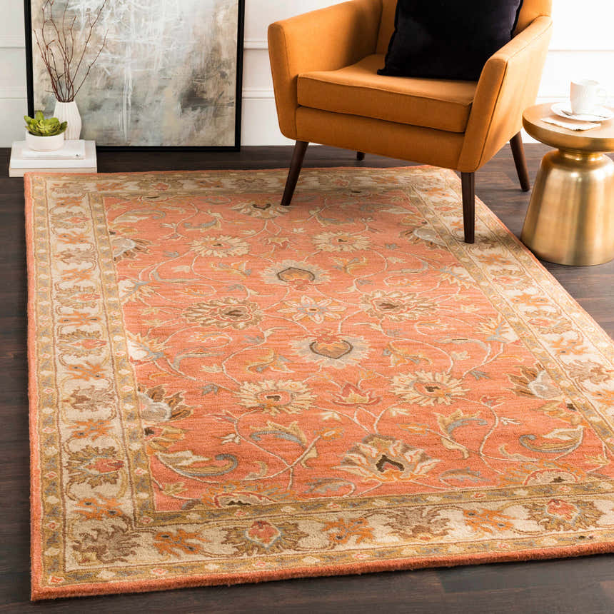 Living room scene with a Caesar Hand Tufted Burnt Orange Wool Carpet, orange chair, gold side table, and modern art. Roomscene-Rectangle