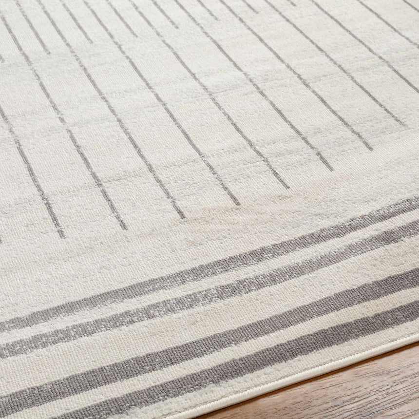 Close-up of Chet Area Rug with a cloud gray and dark gray geometric striped design. Contemporary style. Texture
