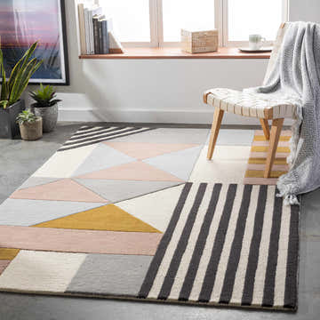 Modern living room with geometric Coorparoo Wool Area Rug in beige, black, pink, gray, and mustard colors. Roomscene-Rectangle