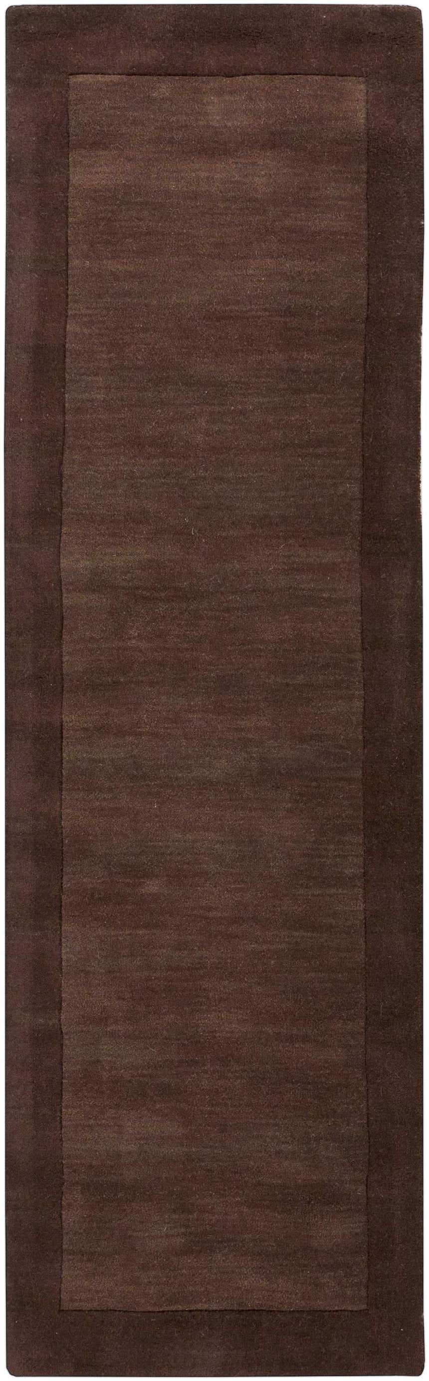 Close-up of a Bordered Solid Brown Wool Rug. The rug has a dark brown border and a slightly lighter brown center. Design-Runner-268