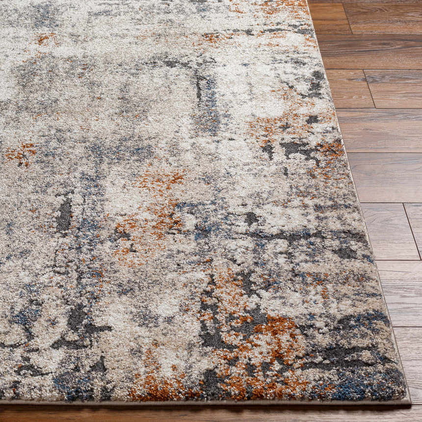 Close up of a Cashi Thick Luxe Rug showing the clay, mocha, and off-white abstract pattern and textured pile. Front