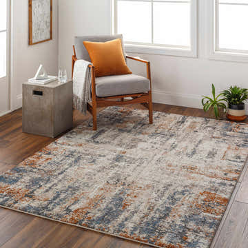 Living room scene with a Cashi Thick Luxe Rug in clay, dark brown, mocha, and off white. Mid-century chair and concrete side table. Roomscene-Rectangle