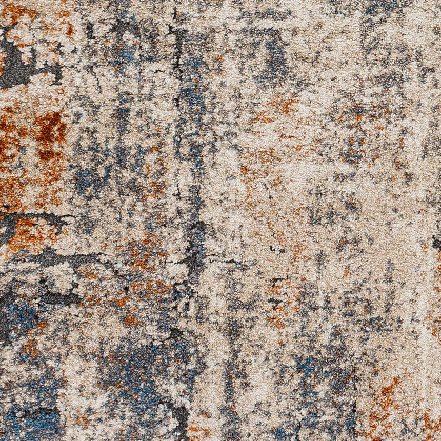 Close-up of Cashi Thick Luxe Rug showing a textured pattern in clay, dark brown, mocha, and off-white hues. Swatch