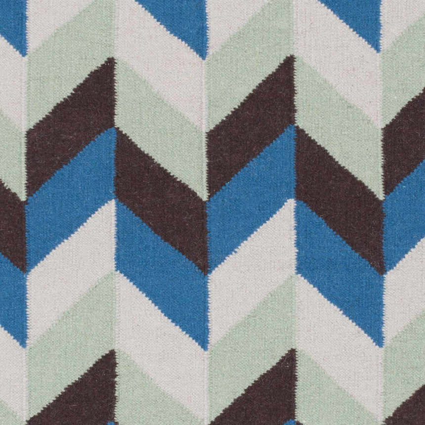 Close-up of the Curtin Carpet, a hand-woven wool rug with a contemporary chevron pattern in blue, navy, sage, and white. Swatch