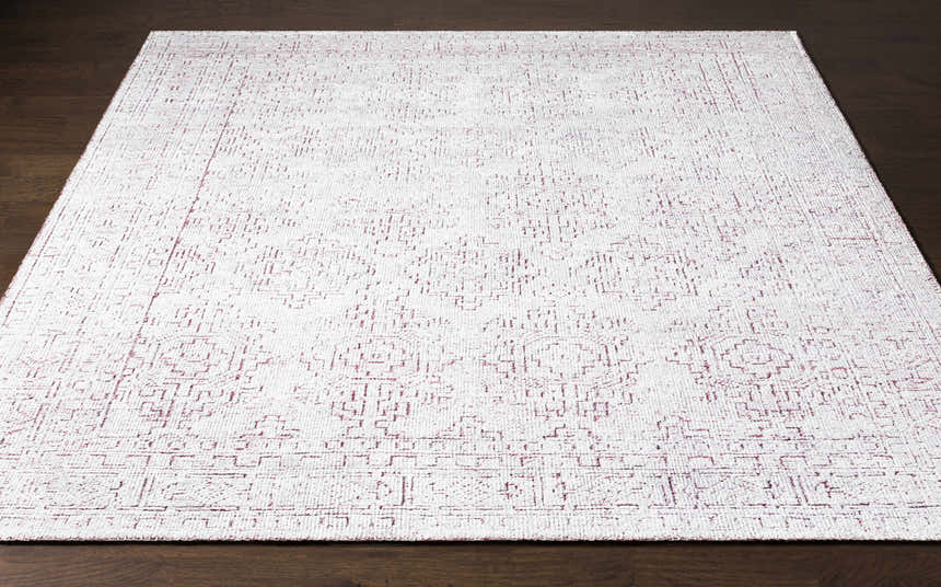Close-up of the Cunderdin Carpet, a hand-knotted rug in mauve and white with a traditional farmhouse design. Front