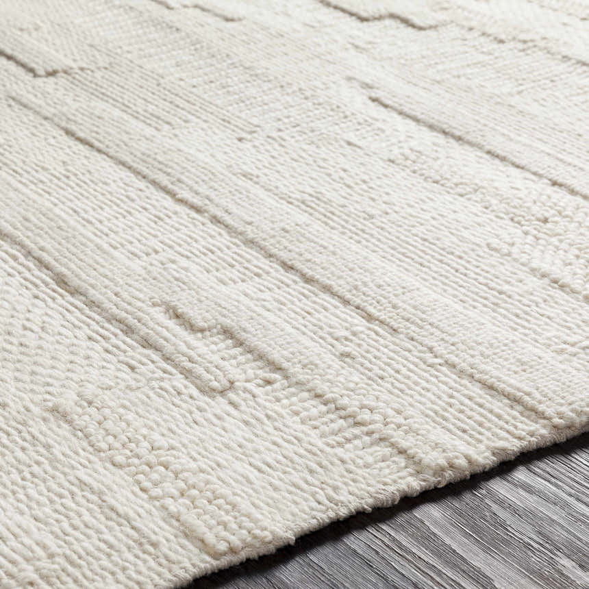 Close-up of the Cypress Cream Textured Wool Rug, showing the hand-woven texture and subtle geometric pattern. Texture