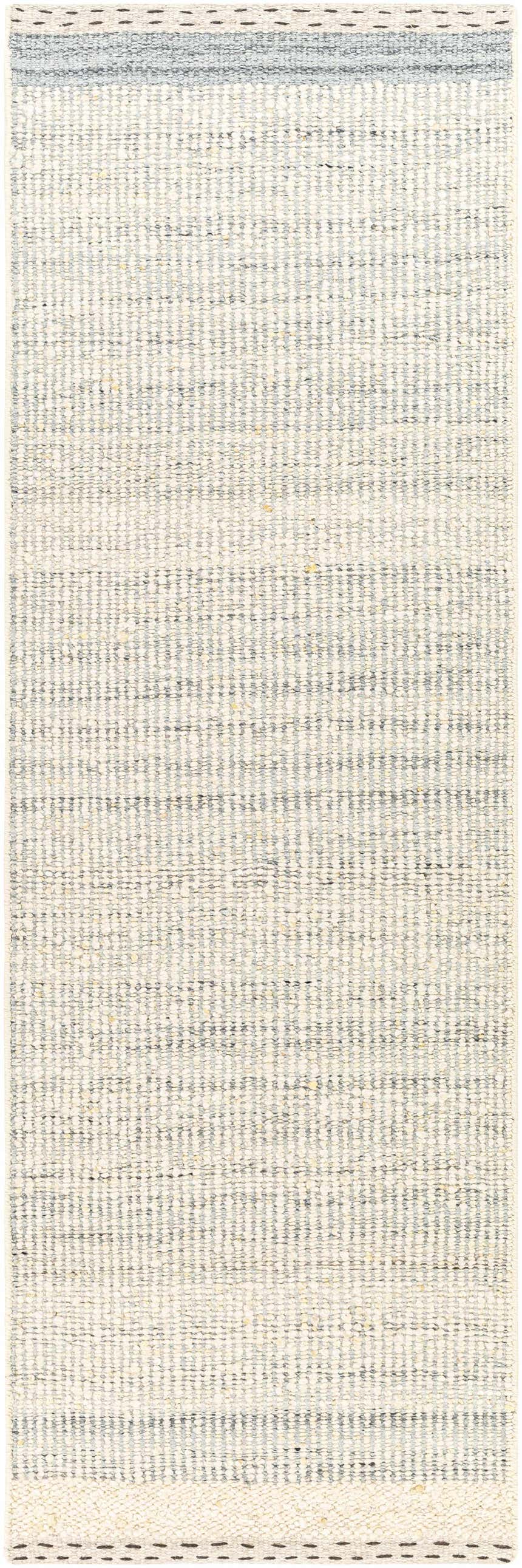 Close-up of the Dalaoig flat woven wool rug. Cream and denim stripes create a subtle pattern and soft texture. Design-Runner-268