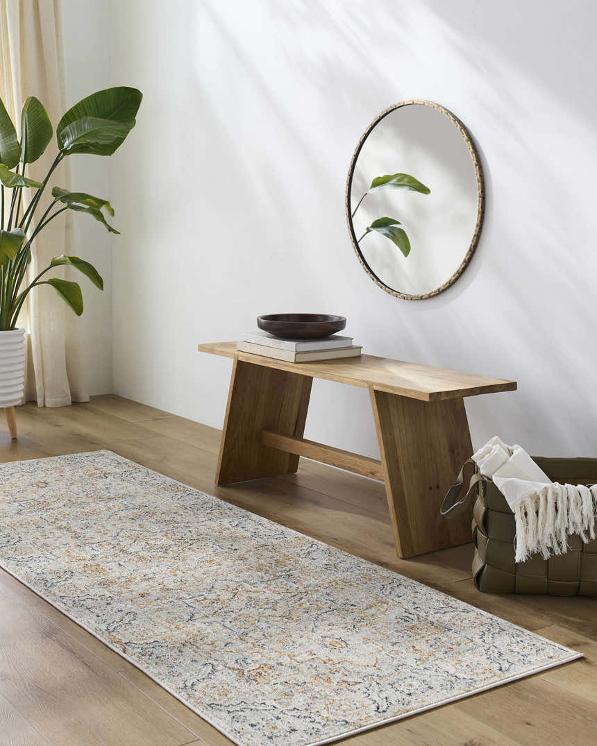 Entryway with a light wood bench, round mirror, and the neutral, traditional Darvel Luxe Rug. Roomscene-Runner