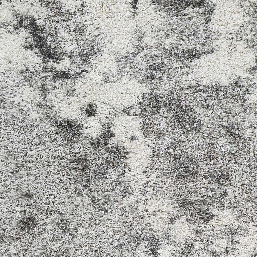 Close-up of the plush Dawesville Gray White Shag Area Rug showing its soft, textured pile and abstract gray and white pattern. Swatch