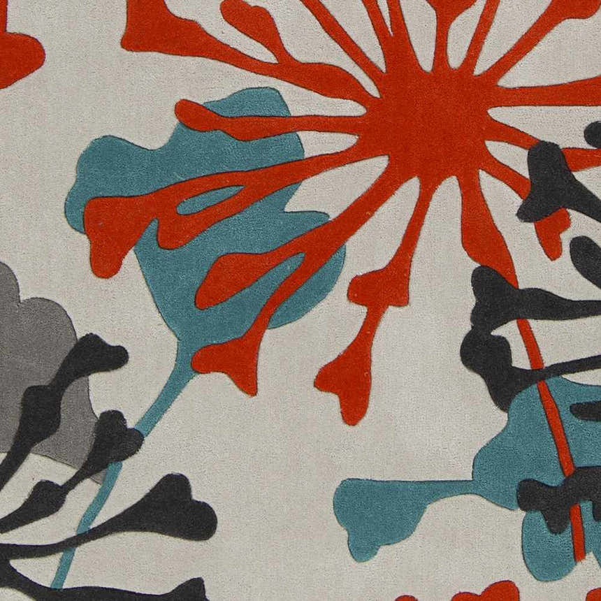 Close-up of the Dickens Colorful Blooming Rug, featuring a floral design in red, teal, black, charcoal, and off-white. Swatch