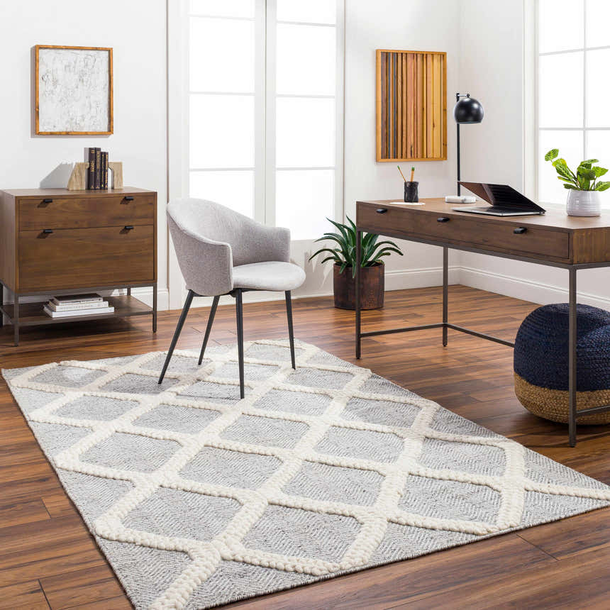 Home office with Della Area Rug in gray and white geometric design, wood desk, and modern chair. Roomscene-Rectangle