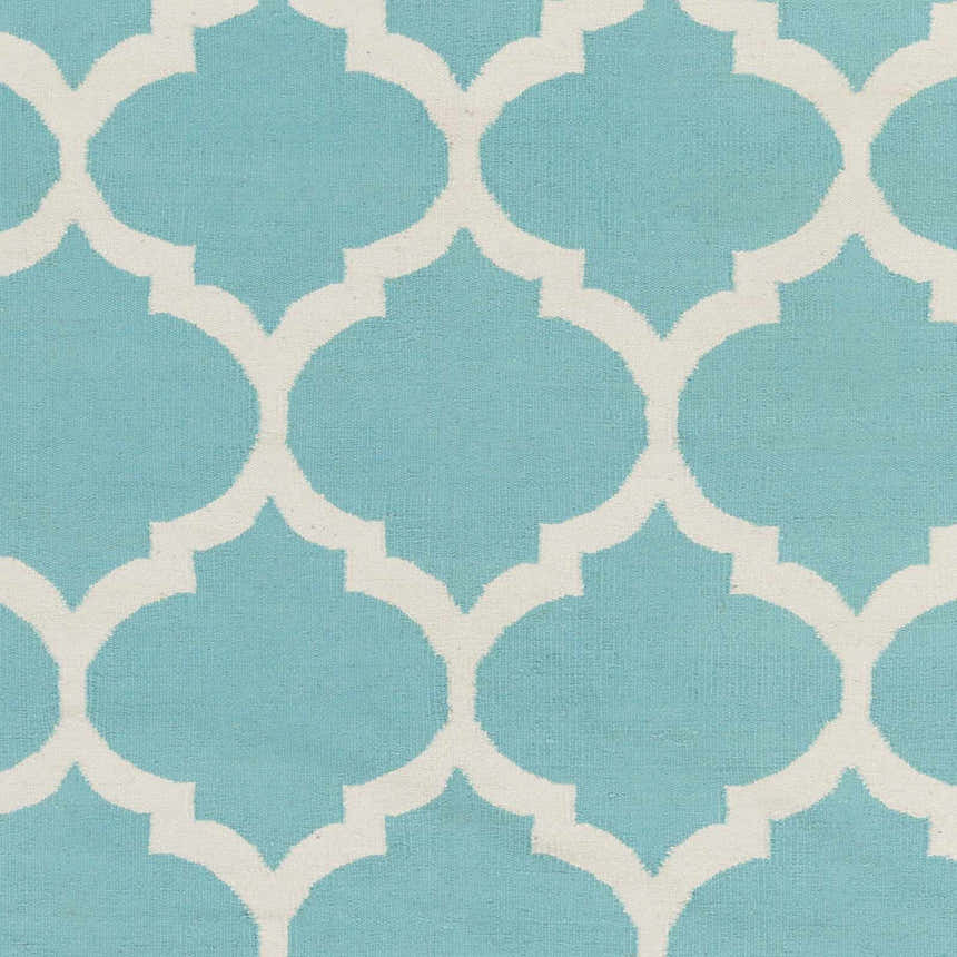 Close-up of the Derry Area Rug in aqua and ivory. Hand-woven cotton rug with a contemporary quatrefoil pattern. Swatch