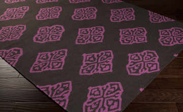 Close-up of the Doran Wool Area Rug featuring a dark brown background and medium purple geometric pattern. Corner