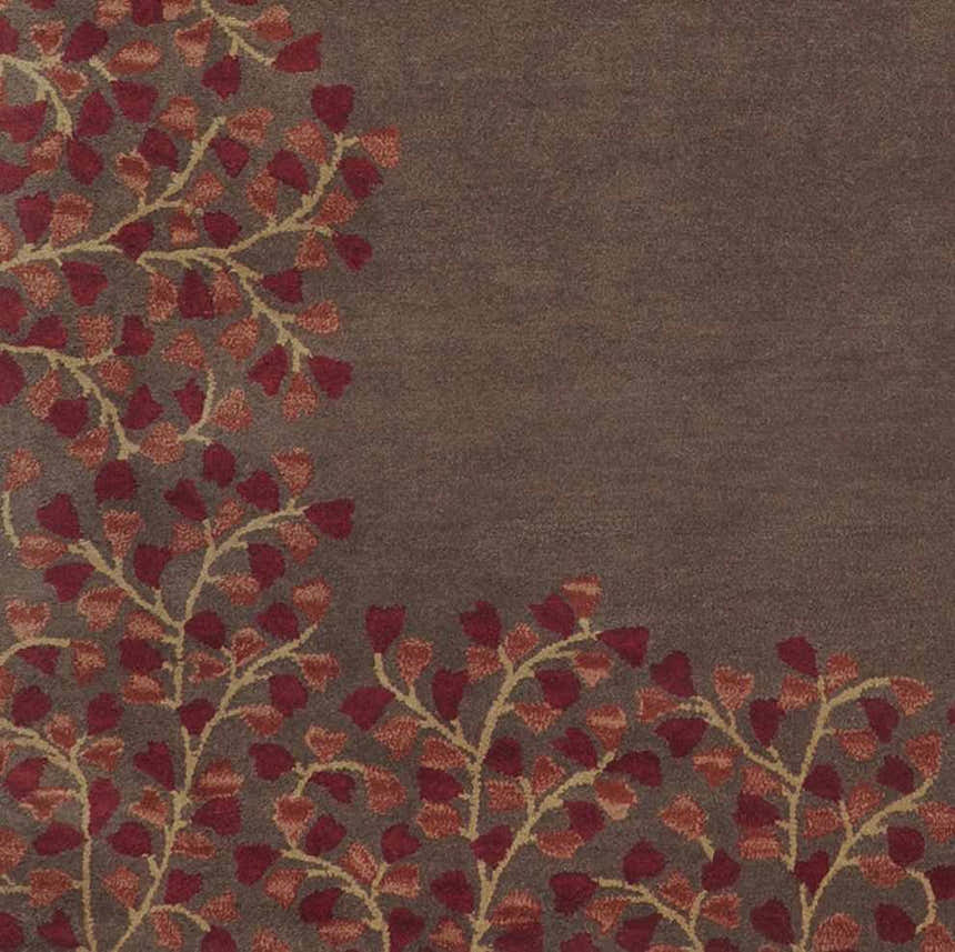 Close-up of the Dovercourt Clearance Rug, featuring a brick red leaf pattern on a dark brown wool background. Swatch