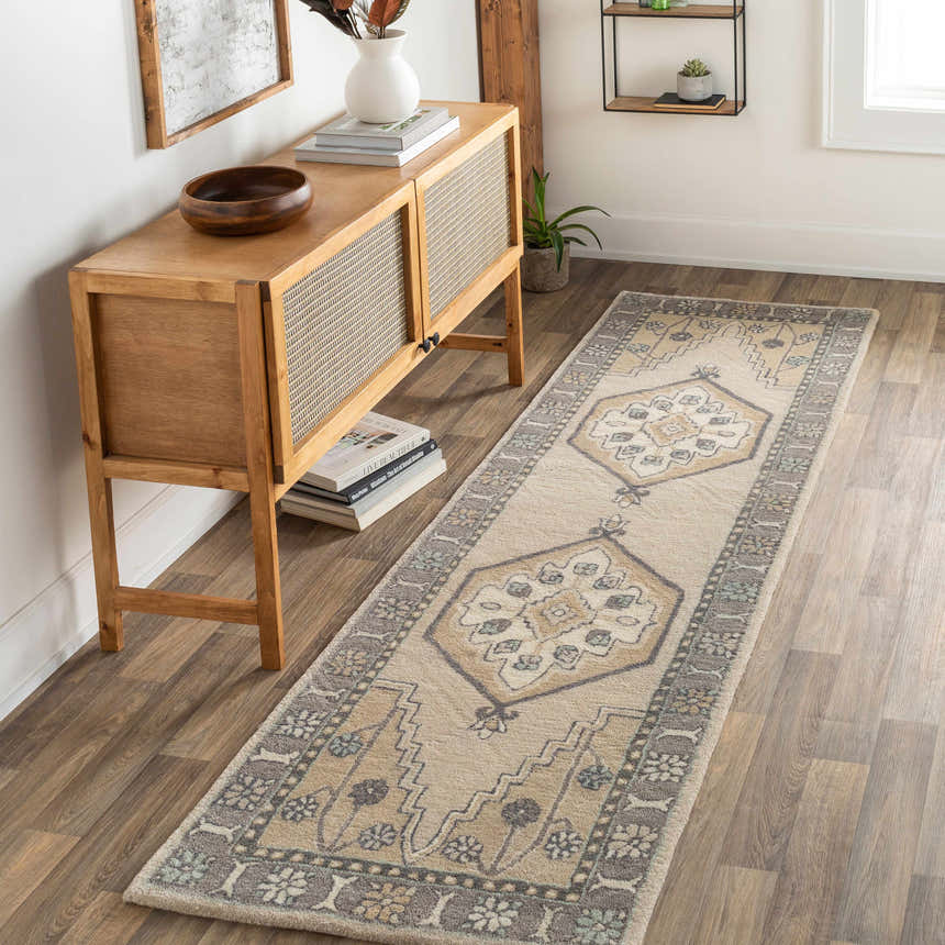 Hallway scene with a Bohemian Duckenfield Area Rug runner in beige, gray, and blue. Wooden console table and decor. Roomscene-Runner