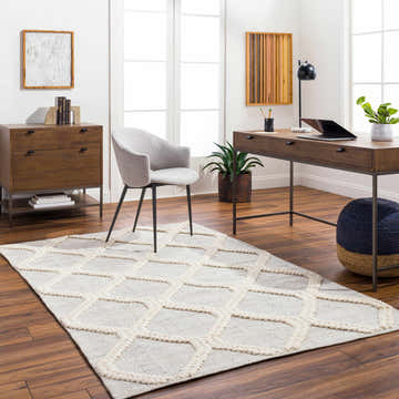 Bright home office with Dusan Area Rug in arctic stone and cloud gray, wood desk, gray chair, and wood floors. Roomscene-Rectangle