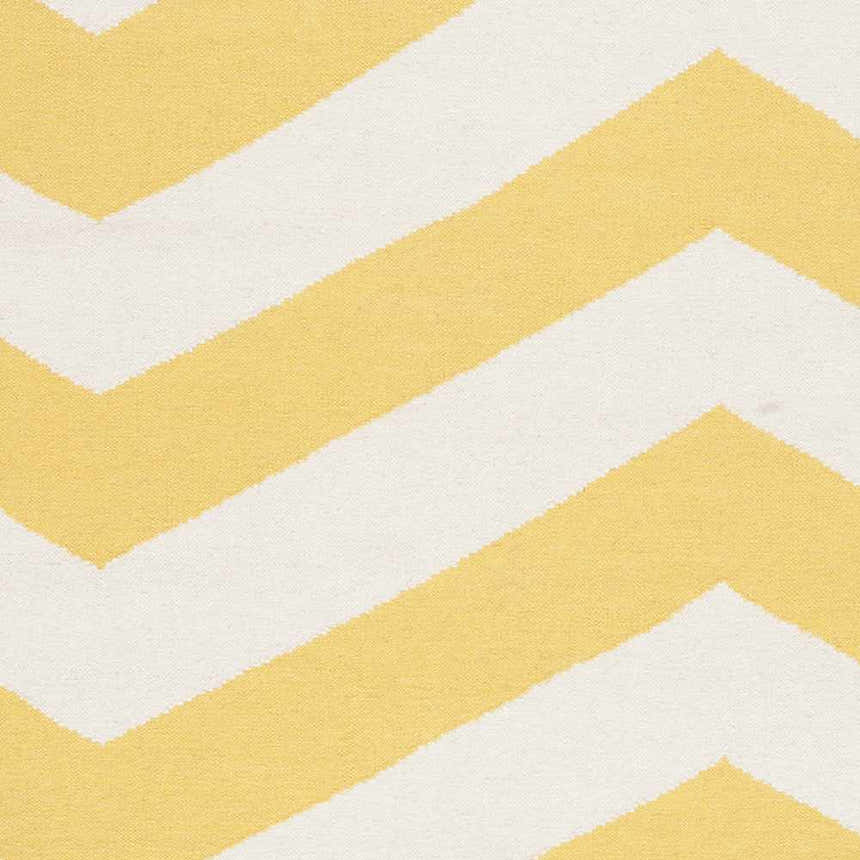Close-up of the Enniskillen Area Rug showing a yellow and white chevron pattern. Hand woven wool texture. Swatch