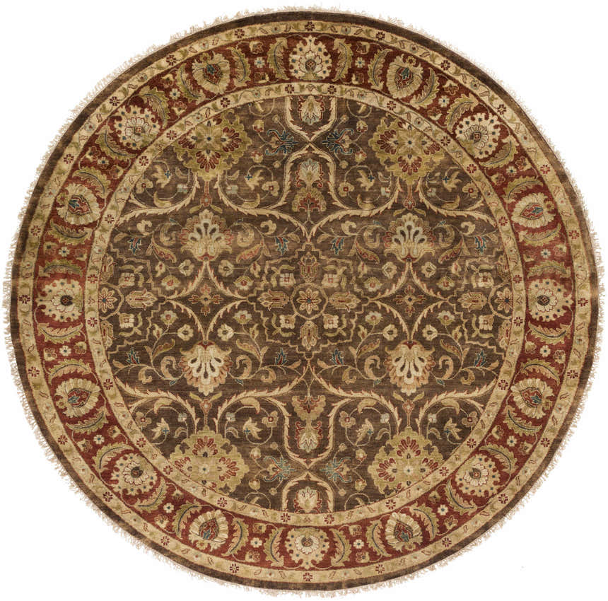 Detailed floral pattern on a round Fate Area Rug. Colors are burnt orange, brown, and blue. Hand knotted wool. Design-Round