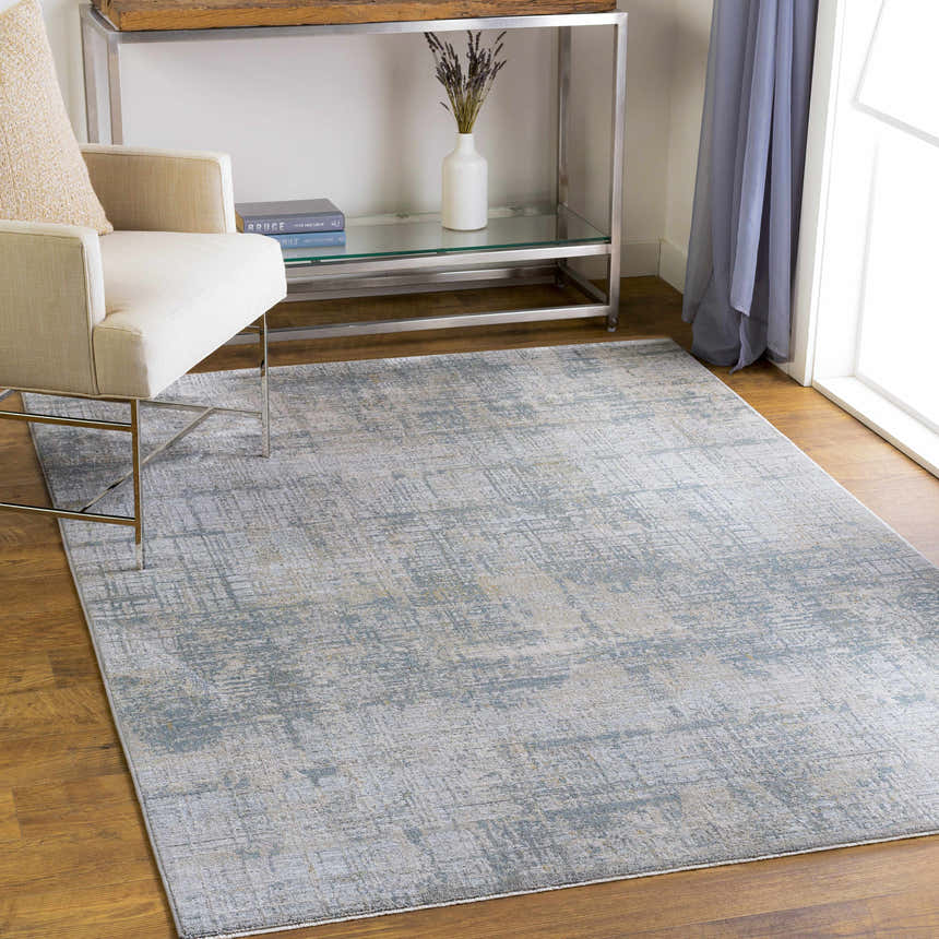 Living room scene with Fallin Gray Thick Luxe Abstract Striped Rug, beige chair, and silver console table. Roomscene-Rectangle